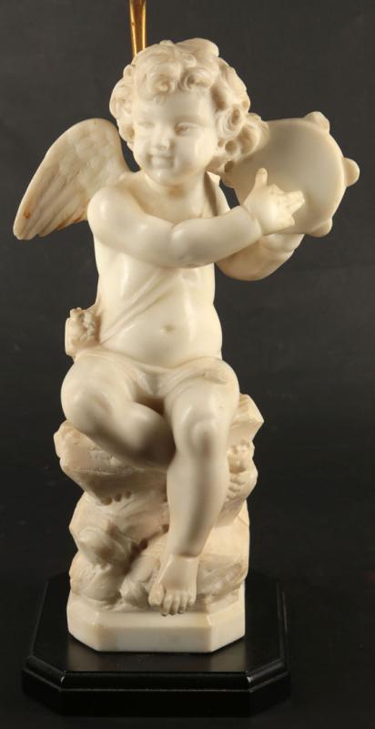 A CARVED MARBLE FIGURE OF CUPID MOUNTED AS A TABLE LAMP