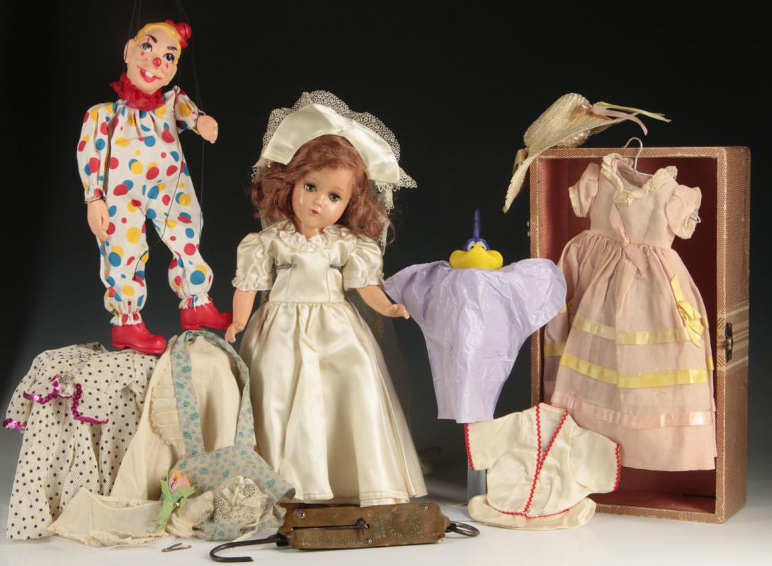 A VINTAGE ARRANBEE DOLL WITH CLOTHES