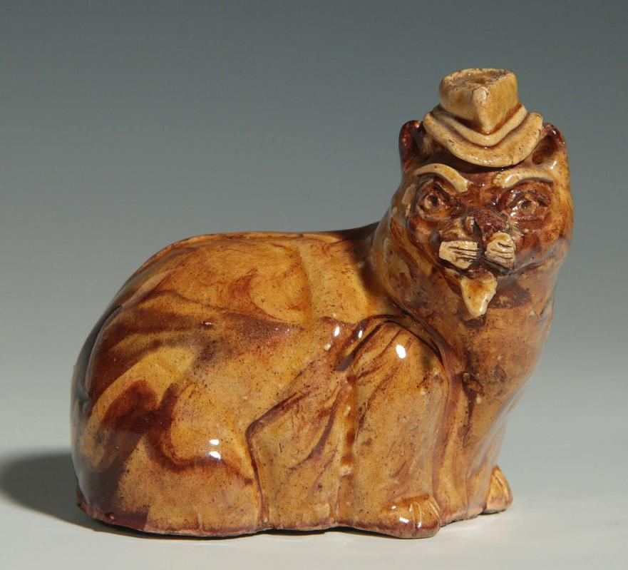 A 19TH CENTURY YELLOW WARE POTTERY CAT 