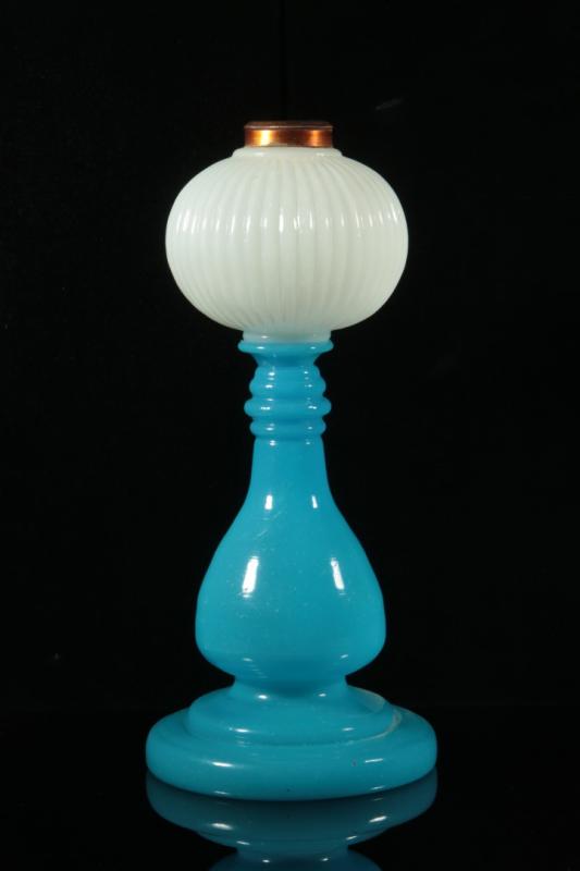 A FRENCH BLUE OPALINE FLUID LAMP WITH WHITE FONT