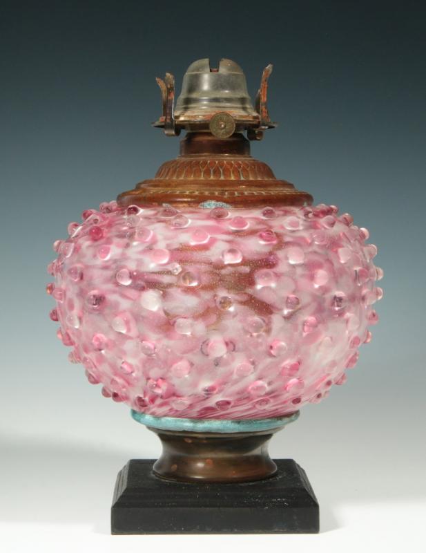 A 19TH CENTURY SPATTER GLASS HOBNAIL LAMP