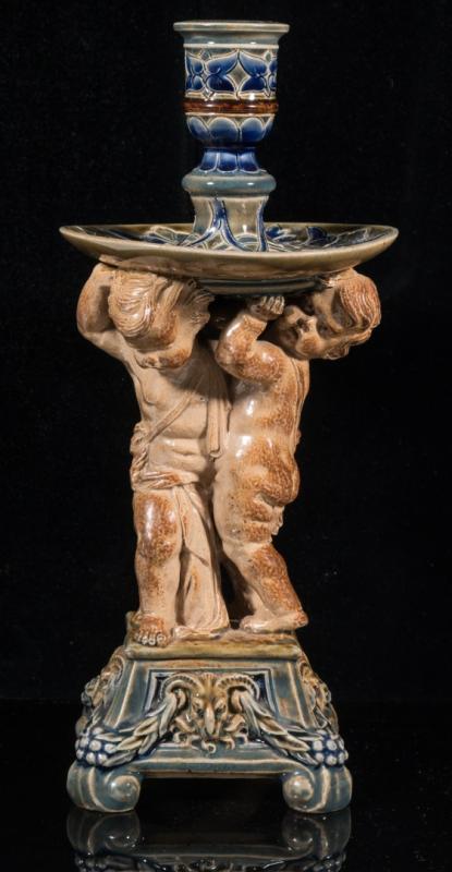 AN 1880 DOULTON LAMBETH PUTTO FIGURE CANDLESTICK