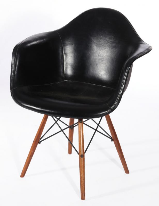 CHARLES AND RAY EAMES LEATHER COVERED ARM CHAIR