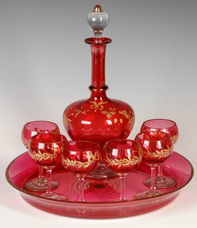 A 19TH CENTURY CRANBERRY GLASS LIQUEUR SET WITH TRAY