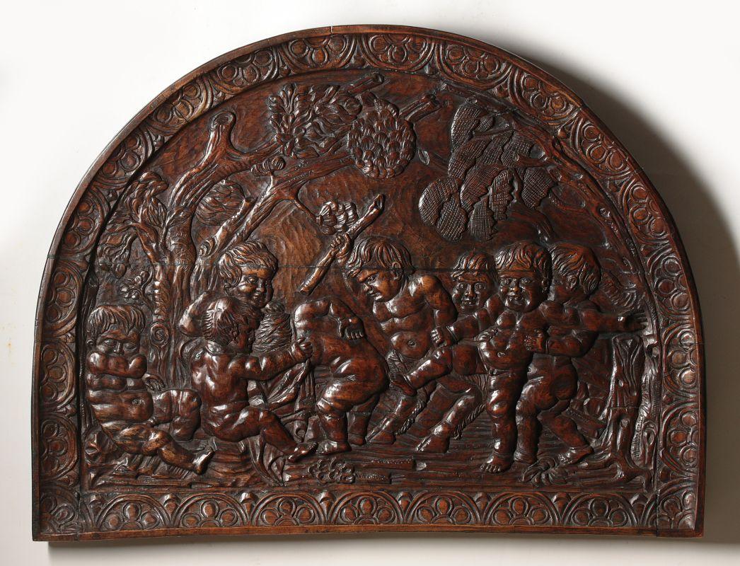 A 19TH CENTURY CARVED WOOD PANEL WITH CHERUBS