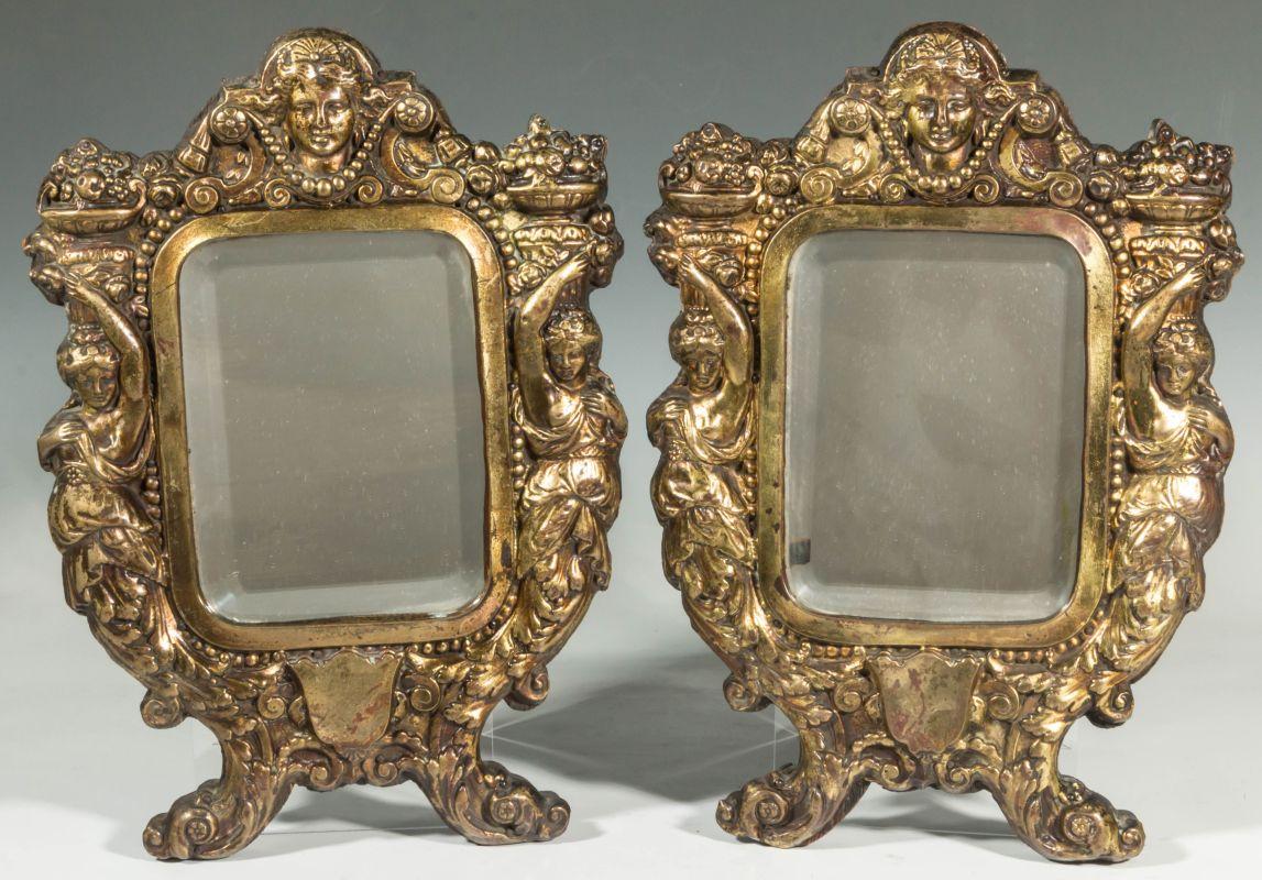A PAIR RENAISSANCE REVIVAL EMBOSSED BRASS MIRRORS