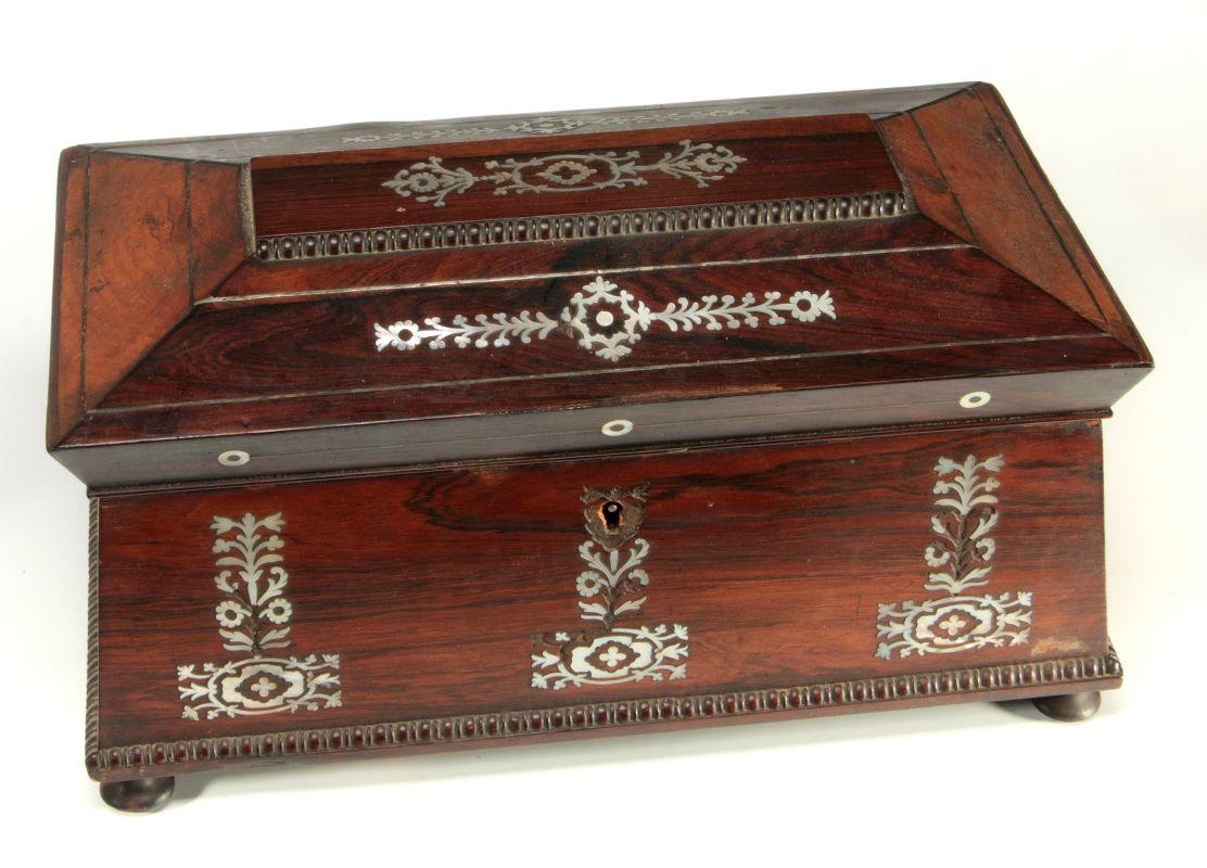 AN EARLY 19TH CENTURY TEA CADDY WITH SHELL INLAYS