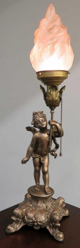 A CUPID FIGURAL BOUDOIR LAMP WITH TORCH SHADE