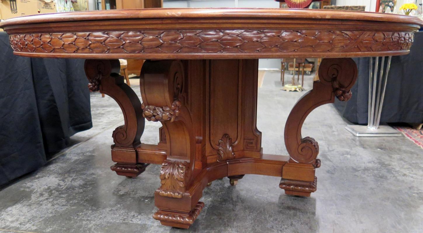 AN OVERSIZED 66-INCH ROUND MAHOGANY DINING TABLE
