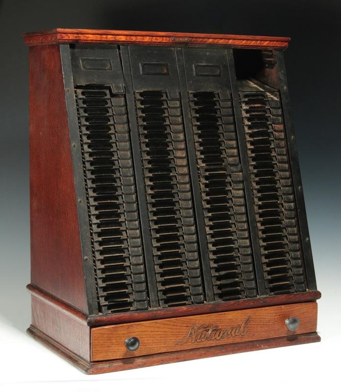 A 'NATIONAL' C. 1900 OAK AND STEEL TICKET CABINET