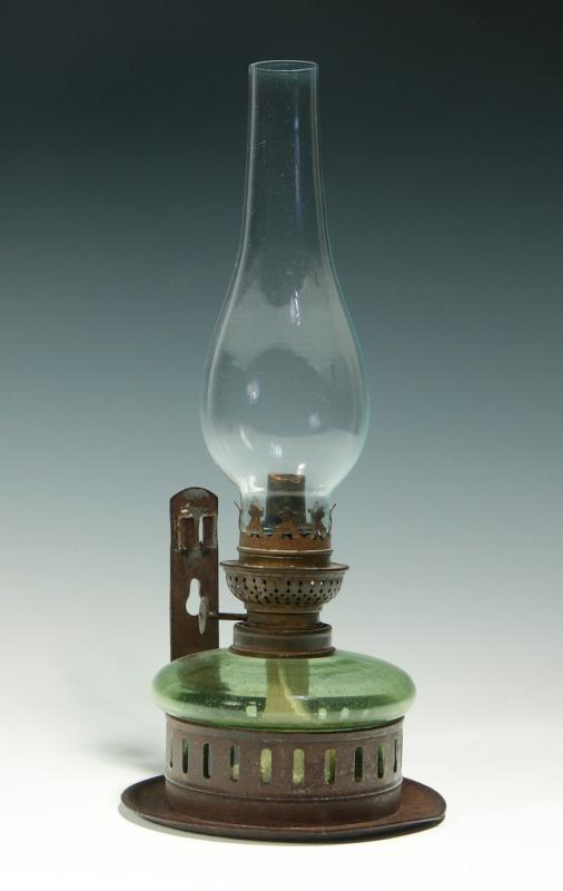 A 19TH CENTURY GREEN GLASS BRACKET LAMP IN TIN