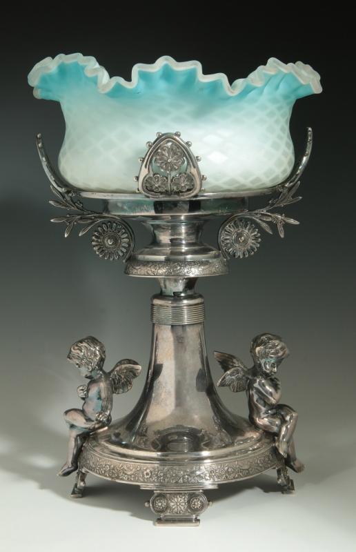 A BLUE MOTHER OF PEARL BRIDE'S BOWL ON CUPID STAND