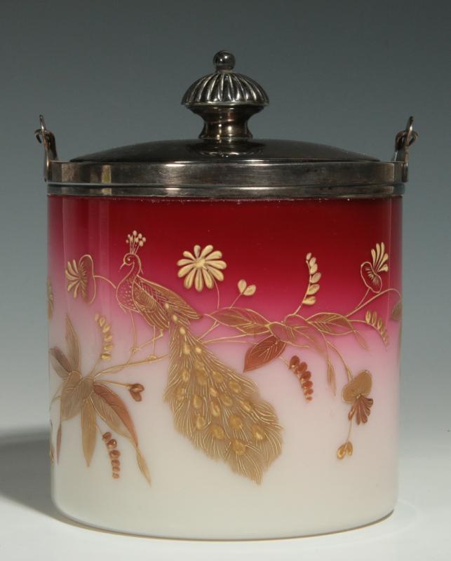A MERIDEN PEACHBLOW BISCUIT JAR WITH PEACOCK DECOR